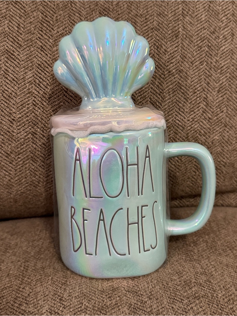 New condition Rae Dunn Aloha Beaches iridescent blue mug with topper